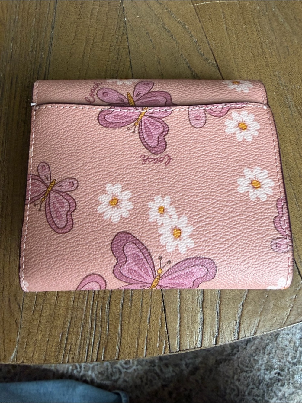 Coach Small Trifold Wallet featuring a lovely butterfly and daisy print - Picture 2 of 3